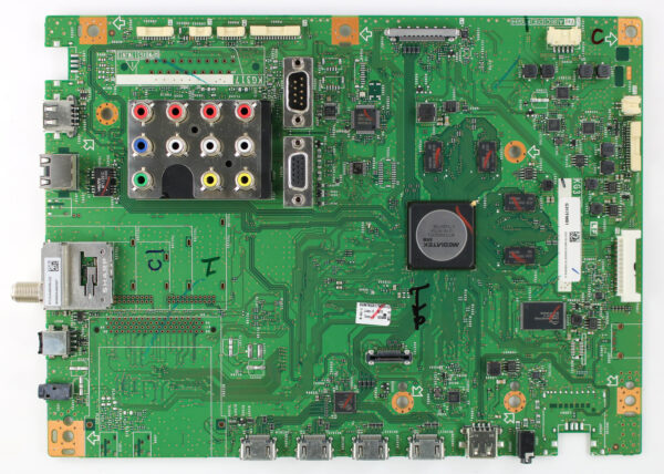 a green circuit board with many connectors