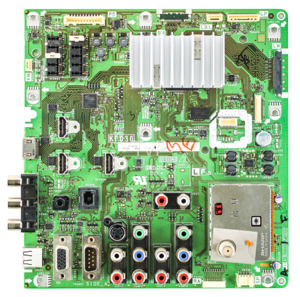 a green circuit board with many connectors and wires