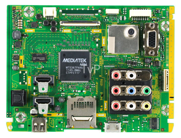 a green circuit board with many connectors and wires