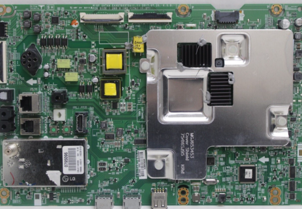 a green circuit board with many different components